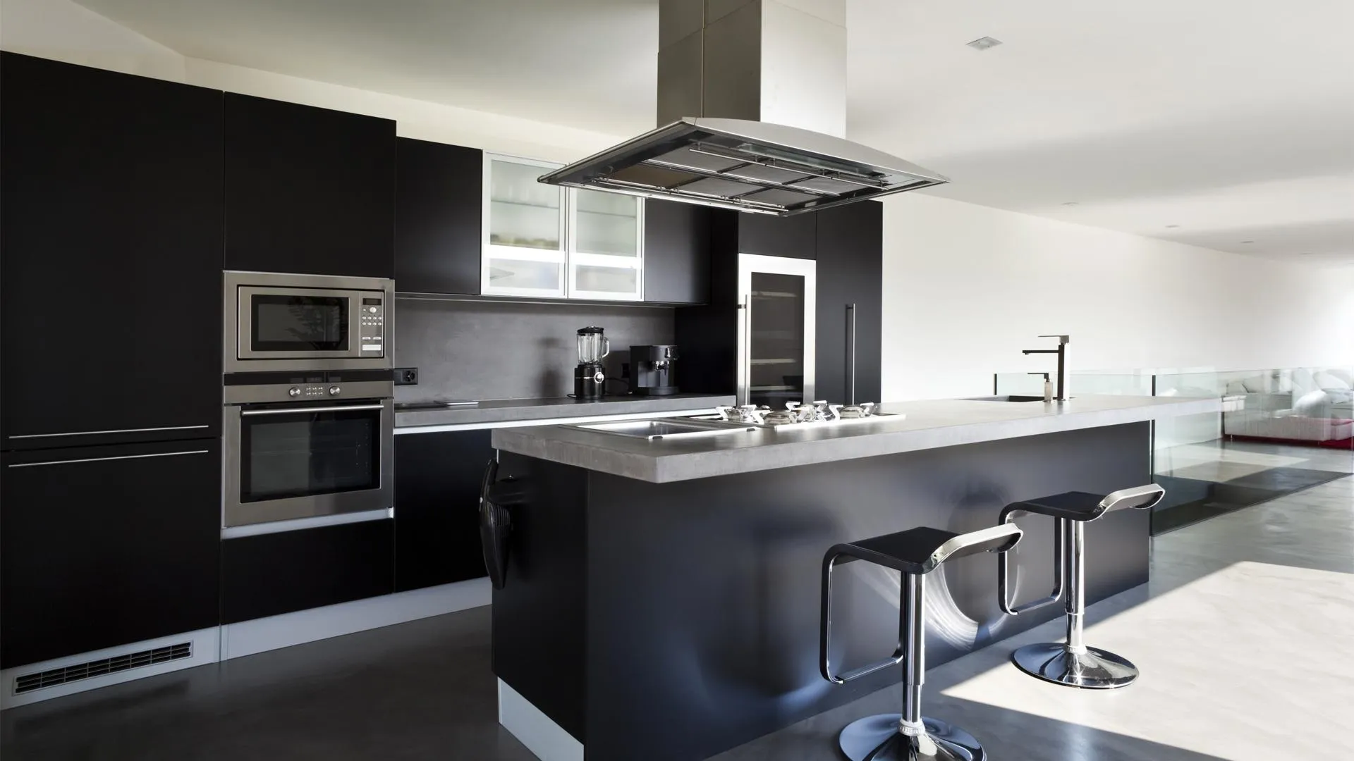 a black and white kitchen with stainless steel appliances